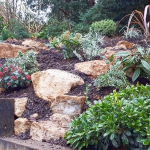 Hillside-planting-with-retaining-sleepers