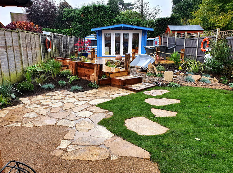 Nautical garden make-over with new paving and decking in a boardwalk style