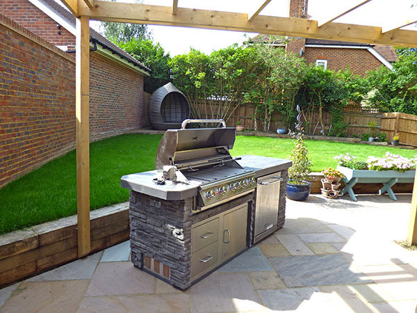 new patio with stone-built outdoor kitchen with cooker