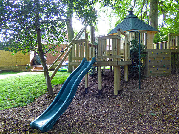 Raised decking play area featuring slide