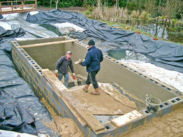 Boardman Gelly’s builders preparing the deep section of swimming pond